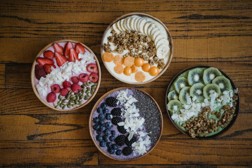  Collage of various fast-filling foods including avocado, oatmeal, Greek yogurt, eggs, lentils, almonds, quinoa, sweet potatoes, spinach, and chickpeas categorized for convenience. Each food item is shown in its natural form, highlighting their nutritional benefits and quick preparation tips.